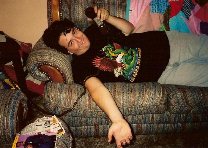 Rob on couch in Harley shirt