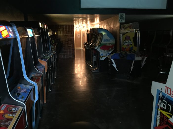 Rob O'Hara in a dark retro arcade.